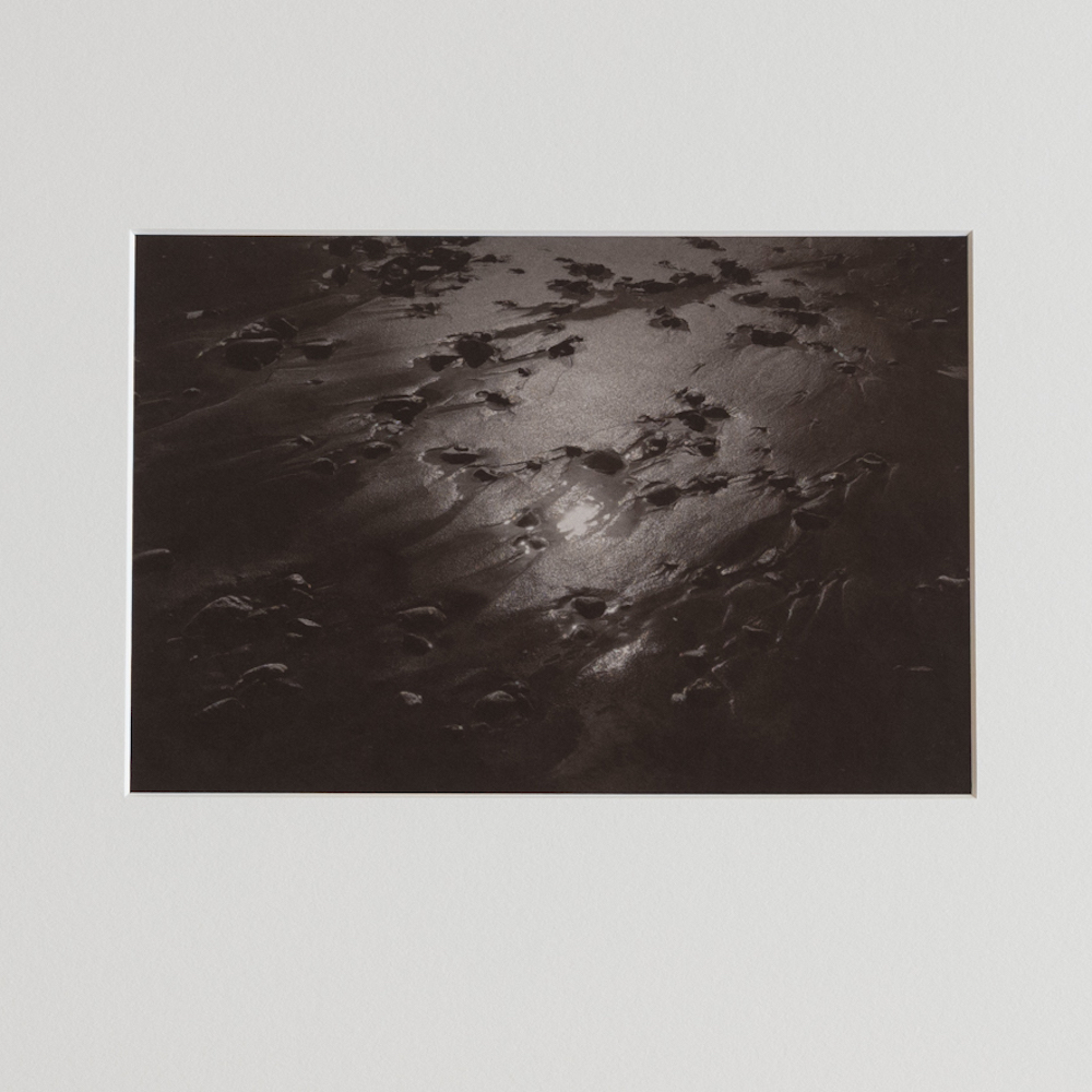 Sand and Sun #6 by Kino Koike, a vertical limited-edition artwork featuring natural landscapes and photographic and realistic imagery, in black and white and grey tones.