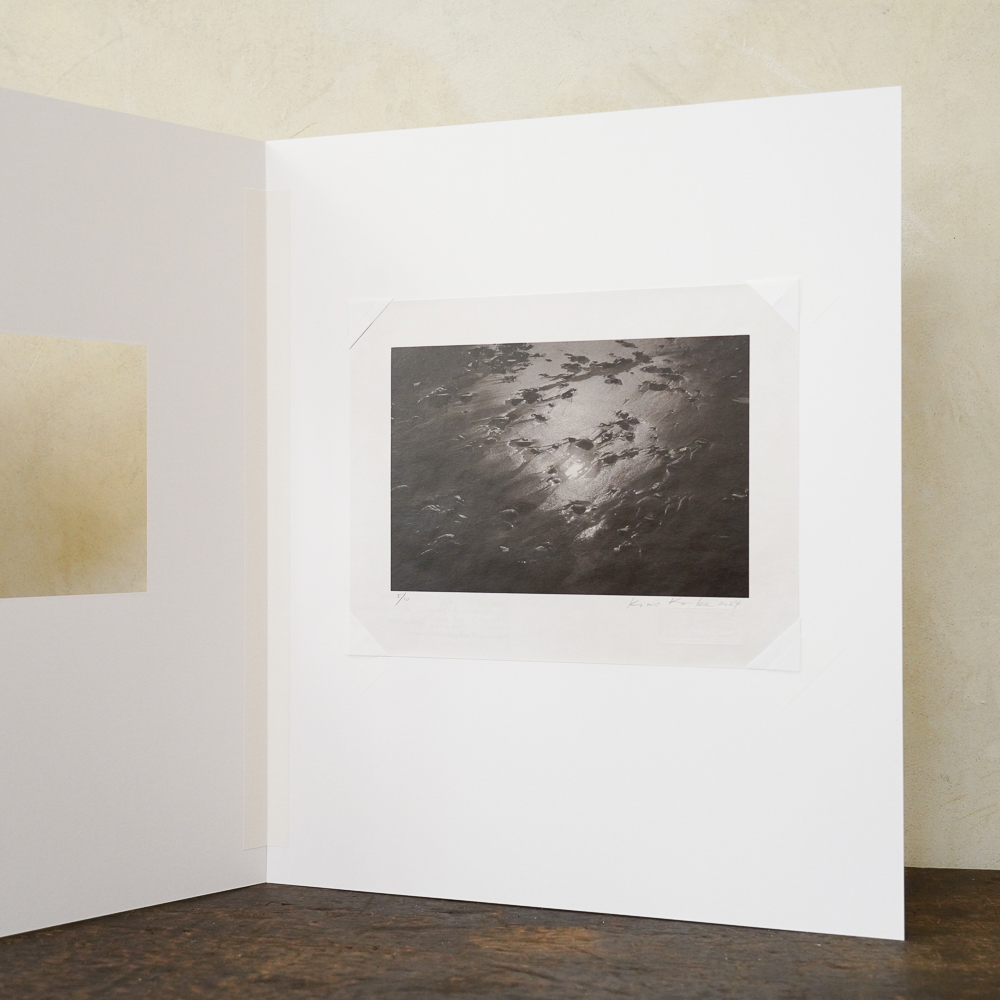 Sand and Sun #6 by Kino Koike, a vertical limited-edition artwork featuring natural landscapes and photographic and realistic imagery, in black and white and grey tones.