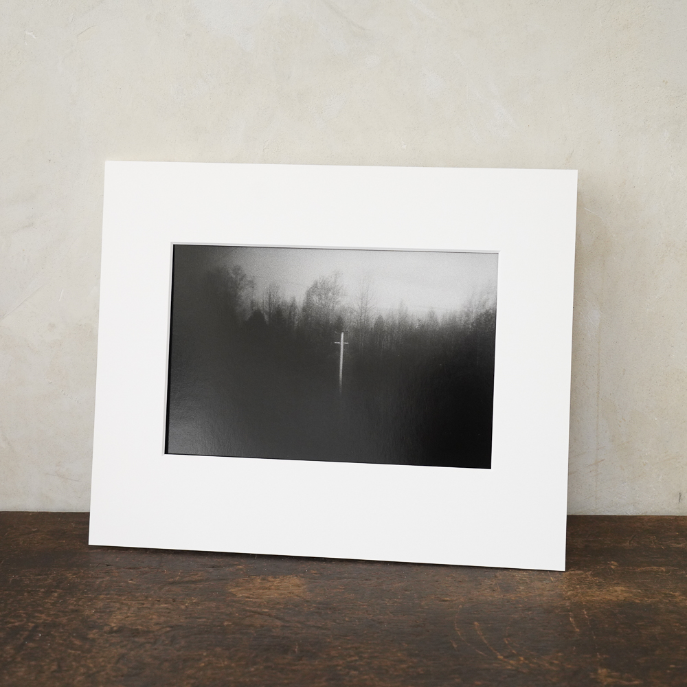 Cross in the Forest #8 by Kino Koike, a horizontal limited-edition artwork featuring natural landscapes and photographic and realistic imagery, in black and white tones.