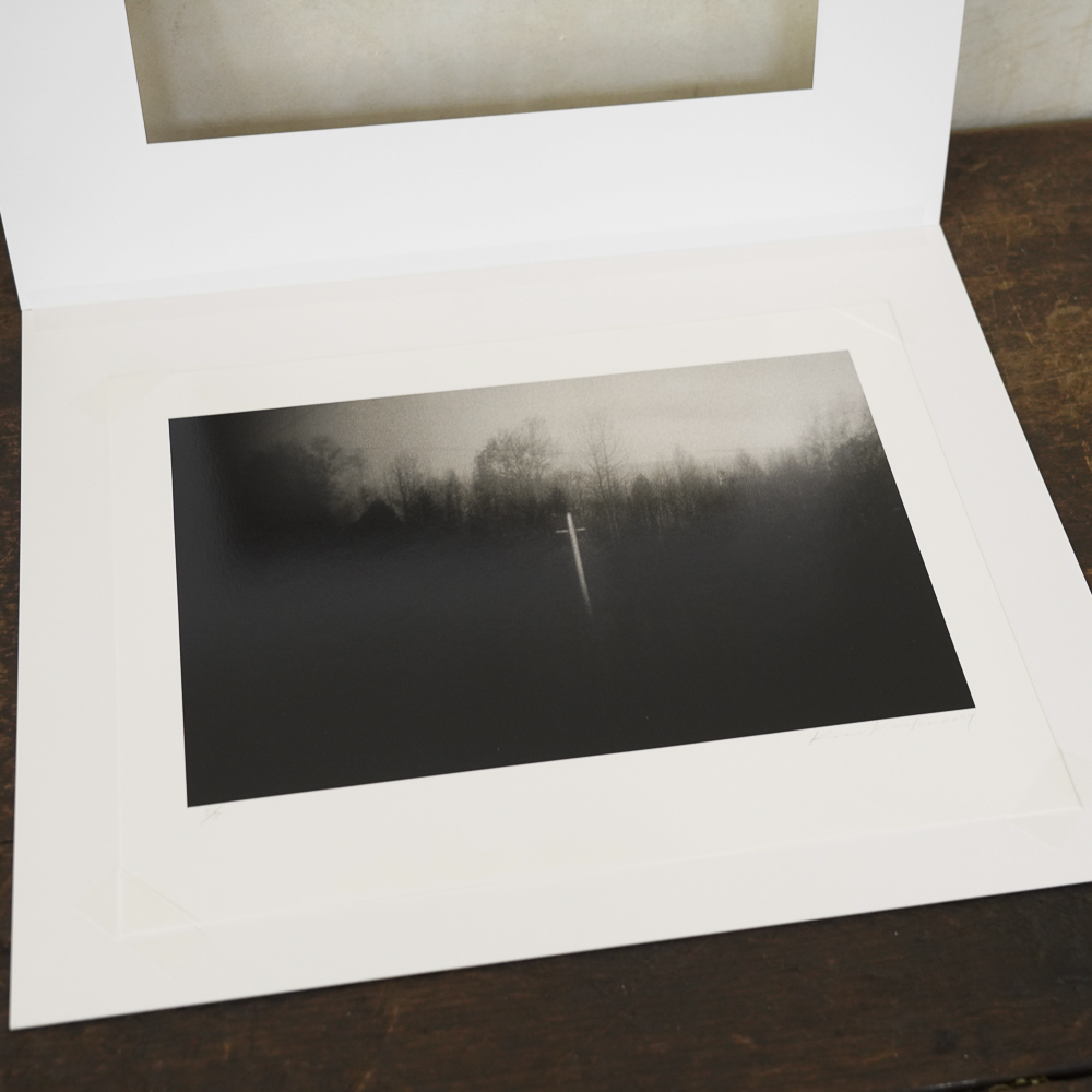 Cross in the Forest #8 by Kino Koike, a horizontal limited-edition artwork featuring natural landscapes and photographic and realistic imagery, in black and white tones.