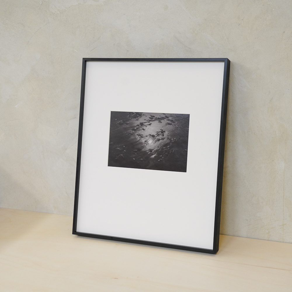 Sand and Sun #6 by Kino Koike, a vertical limited-edition artwork featuring natural landscapes and photographic and realistic imagery, in black and white and grey tones.