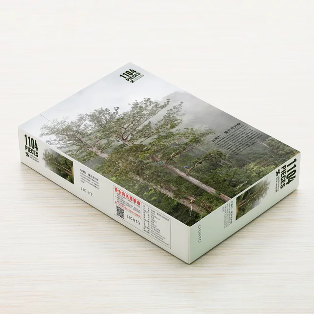 Puzzle · The tree that hit the moon-Taiwanese fir by The Tree Projects, an artist-designed object featuring natural landscapes and photographic and realistic imagery, in multicoloured tones. Cover image.