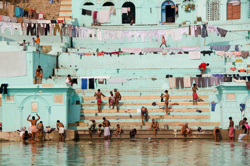 Rafting in India-along the varanasi by aPo, a horizontal art print featuring photographic and realistic imagery, in teal and green tones. Artwork image.